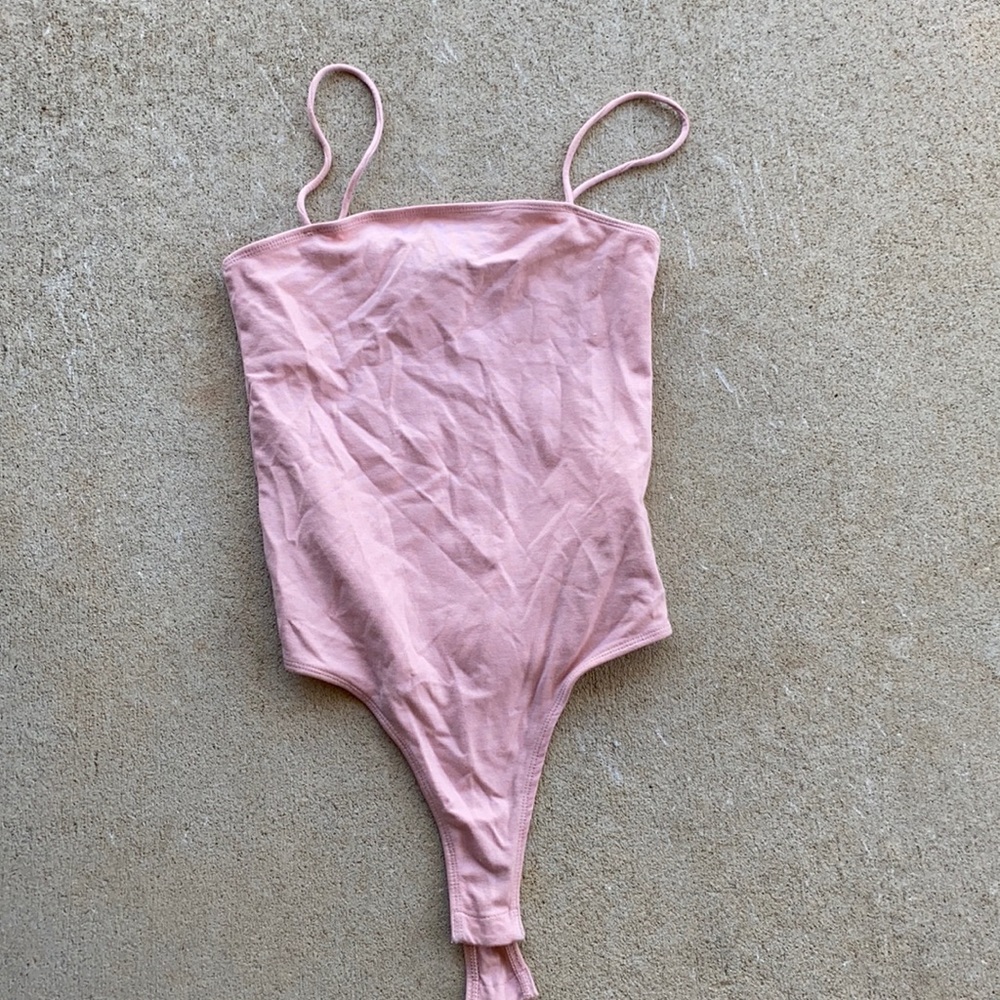 Pink body suit